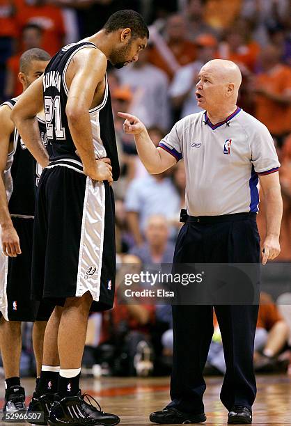 Tim Duncan of the San Antonio Spurs discusses a call with referee Joe Crawford in the second half against the Phoenix Suns in Game one of the Western...