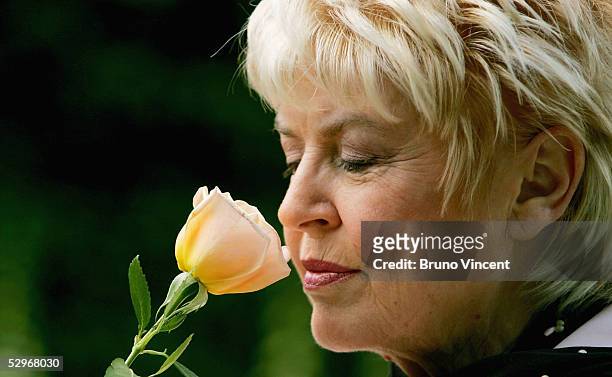 Gloria Hunniford smells the Caron Keating Rose at the Royal Horticultural Society's Chelsea Flower Show, May 23, 2005 in London. The rose is named...