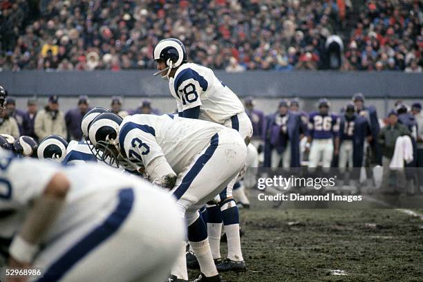 Quarterback Roman Gabriel of the Los Angeles Rams calls out the signals at the line of scrimmage during the Conference Chanpionship Game on December...