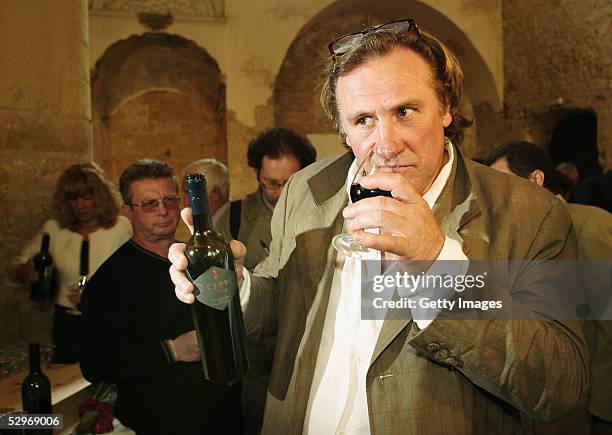 Actor Gerard Depardieu presents his new 2004 vin de garage vintage wine called "Le bien decide" at his 3 hectare vineyard "Coteaux du Languedoc" in...