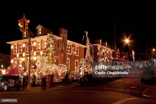 luxury brooklyn houses with christmas lights at night, new york. - dyker heights stock pictures, royalty-free photos & images