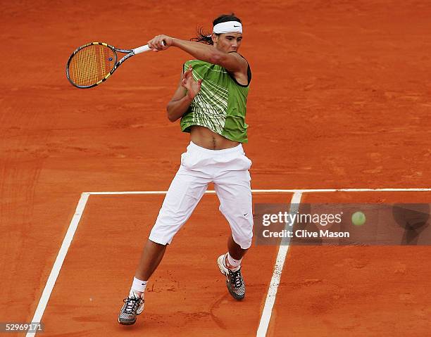 Rafael Nadal of Spain in action during his first round match against Lars Burgsmuller of Germany on the first day of the French Open at Roland Garros...