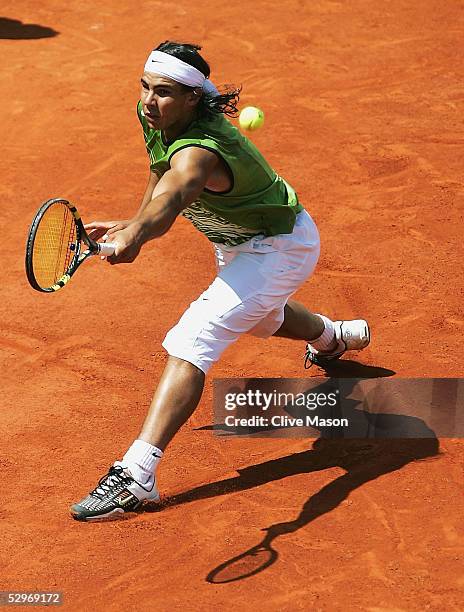 Rafael Nadal of Spain in action during his first round match against Lars Burgsmuller of Germany on the first day of the French Open at Roland Garros...