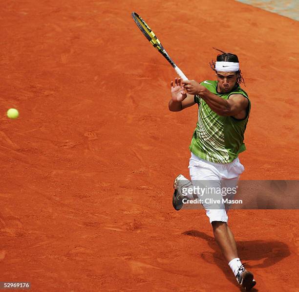 Rafael Nadal of Spain in action during his first round match against Lars Burgsmuller of Germany on the first day of the French Open at Roland Garros...