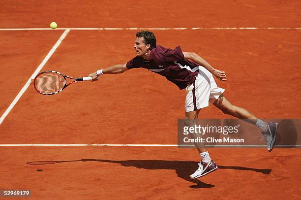 Lars Burgsmuller of Germany in action during his first round match against Rafael Nadal on the first day of the French Open at Roland Garros on May...