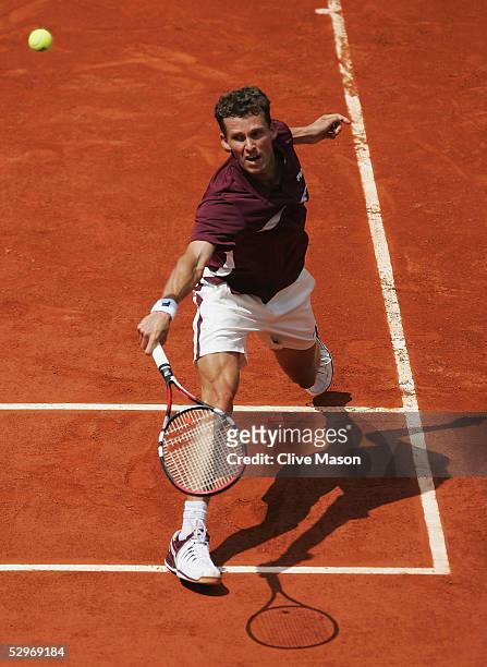 Lars Burgsmuller of Germany in action during his first round match against Rafael Nadal on the first day of the French Open at Roland Garros on May...