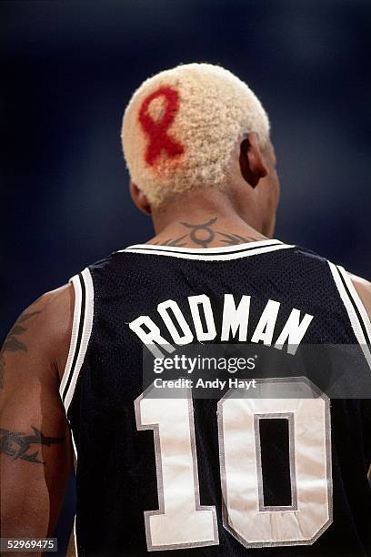 Dennis Rodman of the San Antonio Spurs looks on during Game 3, Round 1 of the 1995 NBA Playoffs against the Denver Nuggets on May 2, 1995 in Denver,...