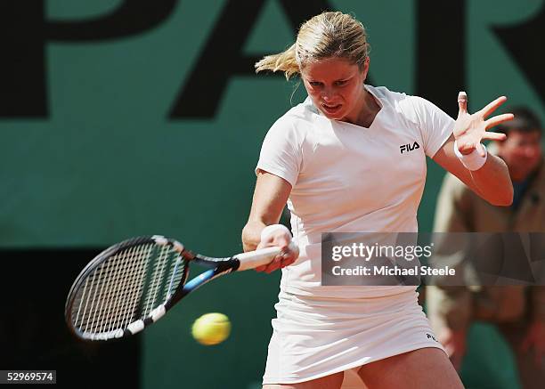 Kim Clijsters of Belgium in action against Meilen Tu of the USA during her first round match on the first day of the French Open at Roland Garros on...