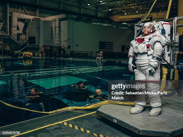 Astronaut Anne McClain who has been selected for a manned mission to Mars is photographed at the Neutral Buoyancy Laboratory for Paris Match at the...