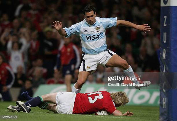 Ollie Smith of the Lions dives over to score his sides opening try during the Rugby Union International Match between the British and Irish Lions and...