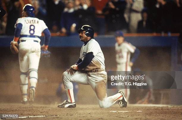 Jim Rice of the Boston Red Sox kneels at home plate during Game seven of the 1986 World Series against the New York Mets at Shea Stadium on October...
