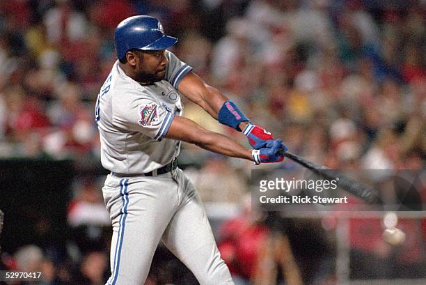 Joe Carter of the Toronto Blue Jays swings at a pitch during Game five of the 1993 World Series against the Philadelphia Phillies at Veterans Stadium...