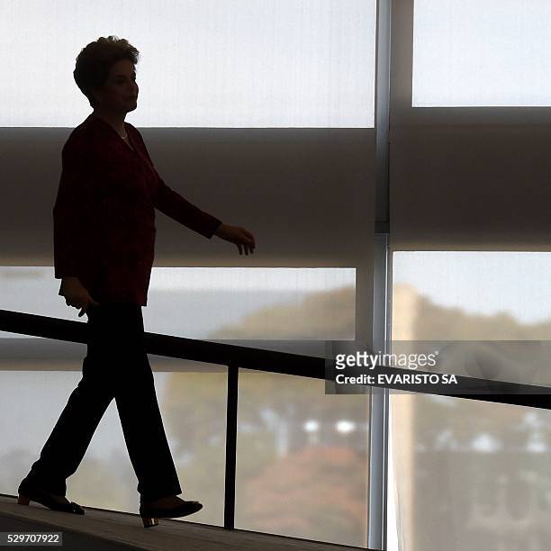 Brazilian President Dilma Rousseff arrives to a ceremony to announce the creation of new public universities, at Planalto Palace in Brasilia, on May...