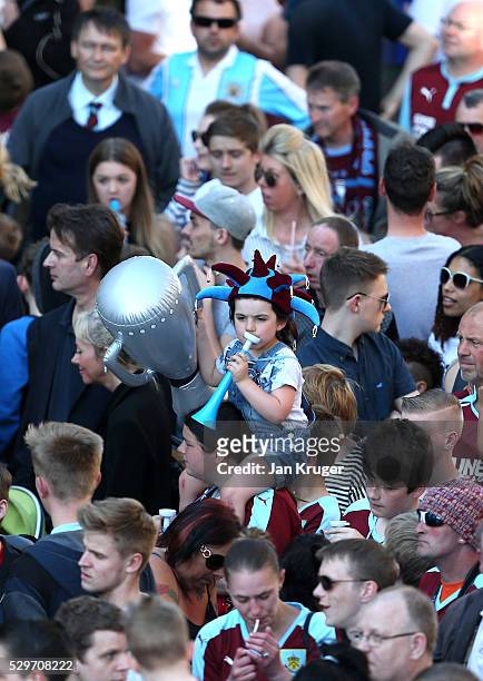 Young fan waits for the teams arrival during the Burnley Sky Bet Champions Winners Bus Parade on May 09, 2016 in Burnley, England.