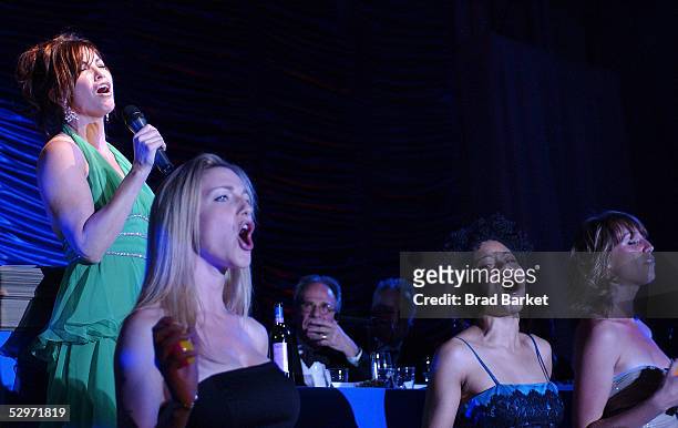 Gina Gershon performs at the "Fish Fry" All-Star Roast Of Fisher Stevens Benefiting Naked Angels at the Puck Building on May 23, 2005 in New York...