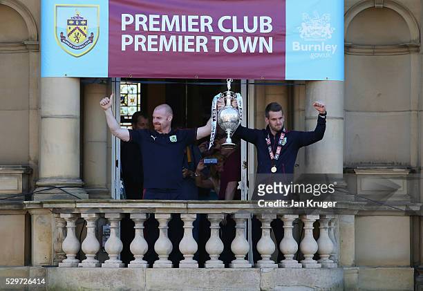 Sean Dyche manager of Burnley and captain Tom Heaton celebrate with the trophy as Sky Bet Champions Burnley are presented with the Championship...