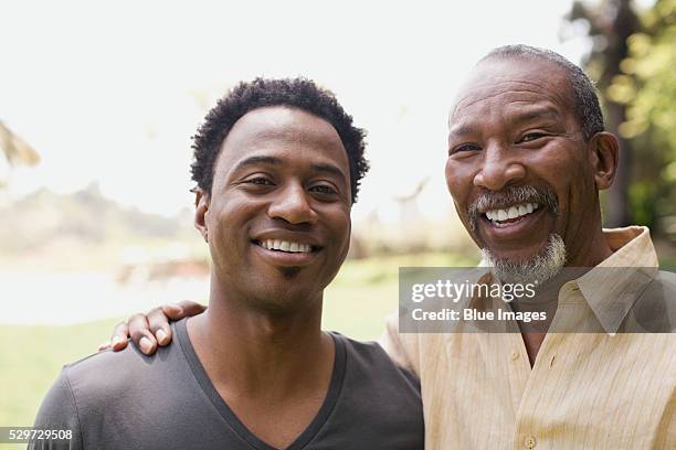 smiling father and son - african american father and son stock pictures, royalty-free photos & images