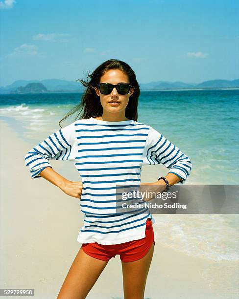 a young scandinavian woman on the beach - striped shorts stock pictures, royalty-free photos & images