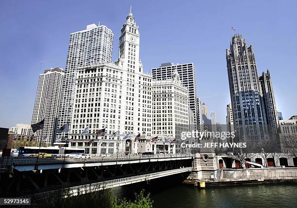 The Wrigley Building and the Tribune Tower flank either side of the Chicago River 20 April 2005, along Michigan Ave. In downtown, Chicago, Illinois....