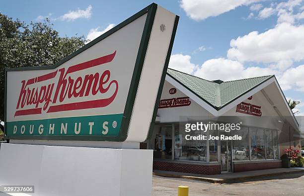 Krispy Kreme Donuts sign is seen outside of a store on May 09, 2016 in Miami, Florida. JAB Holdings Company, announced it is acquiring Krispy Kreme...