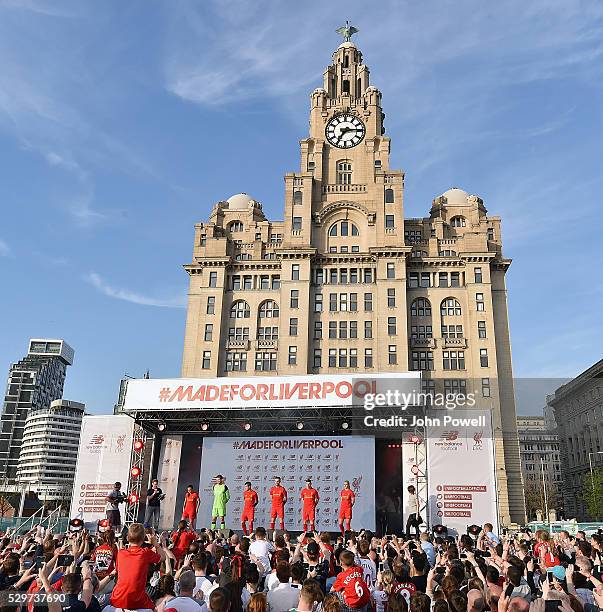 Jordan Henderson, Philippe Coutinho, Jon Flanagan and Simon Mignolet of Liverpool and Gemma Bonner and Natasha Harding of Liverpool Ladies during the...