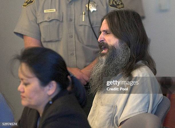 Brian David Mitchell sits briefly at the defense table with lawyer Vernice Trease as he lectures Judge Judith Atherton while inside the Matheson...