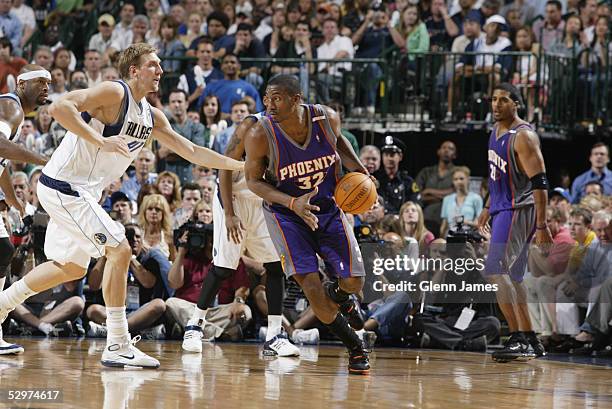 Amare Stoudemire of the Phoenix Suns drives around Dirk Nowitzki of the Dallas Mavericks in Game four of the Western Conference Semifinals during the...