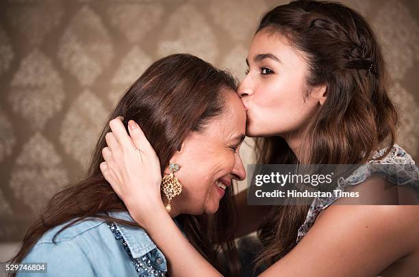 Actor Alia Bhatt kissing her mother Soni Razdan during a profile shoot at their Juhu house on May 4, 2016 in Mumbai, India.