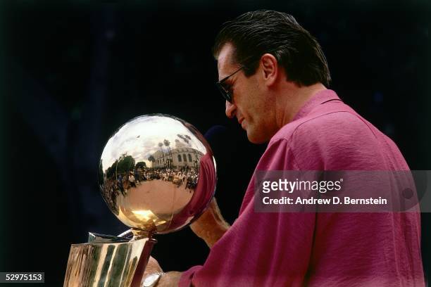 Head Coach Pat Riley of the Los Angeles Lakers waves to the crowd during the parade after winning the 1987 NBA Finals against the Bost Celtics circa...