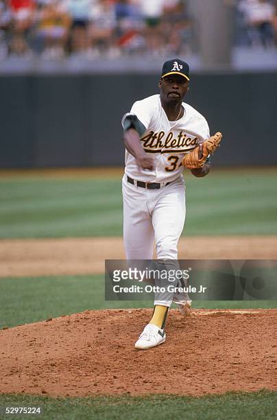 Dave Stewart of the Oakland Athletics pitches during a game in the 1989 season at Oakland-Alameda Coliseum in Oakland, California.