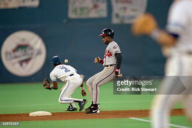 Deion Sanders of the Atlanta Braves gets to second base ahead of the throw during Game three of the 1992 World Series against the Toronto Blue Jays...