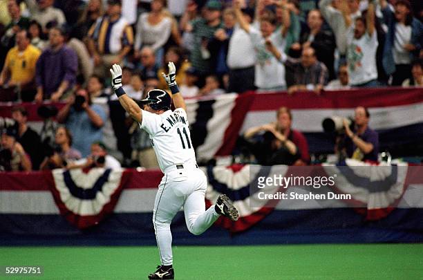 Edgar Martinez of the Seattle Mariners hits a three-run home run in the third inning of Game four of the 1995 American League Divisional Series...