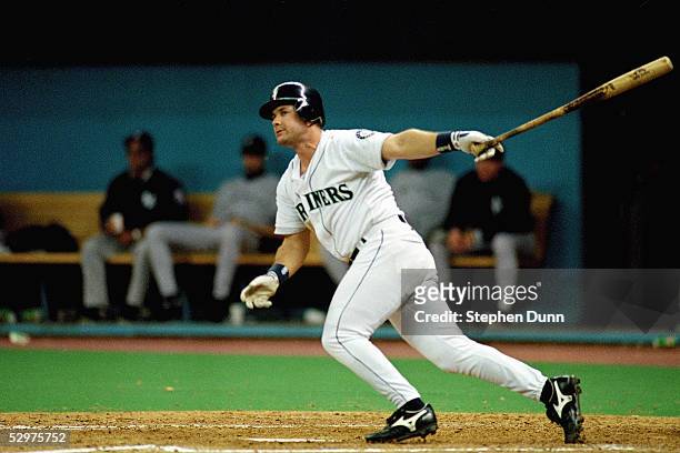Edgar Martinez of the Seattle Mariners doubles home the game winning runs in Game five of the 1995 American League Divisional Series against the New...