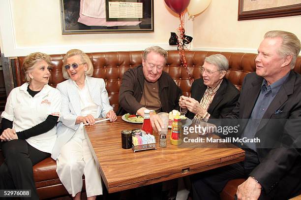 Suzanne Pleshette serves lunch to Barbara Davis, Tom Poston, an unidentified guest and Jon Voight at a party celebrating the 60th anniversary of Nate...