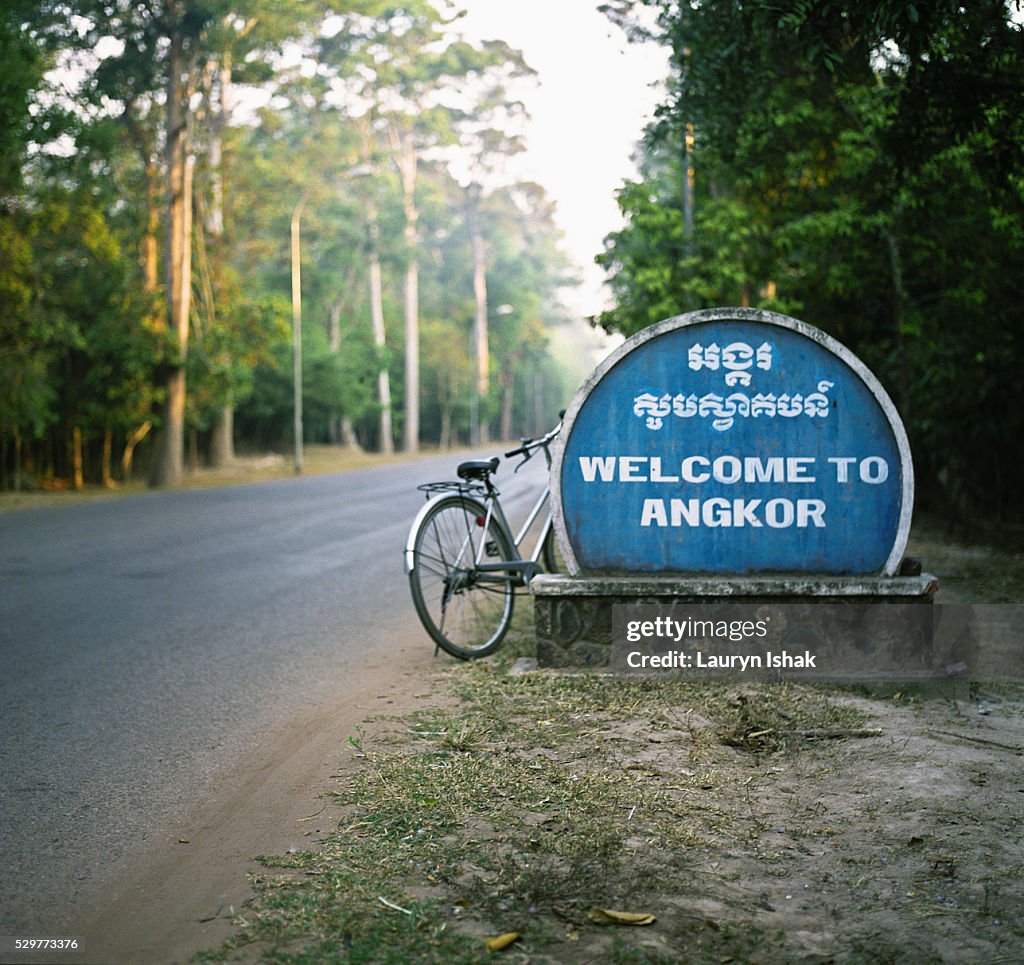 Welcome sign by road