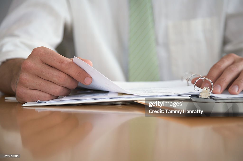 Businessman reviewing paperwork