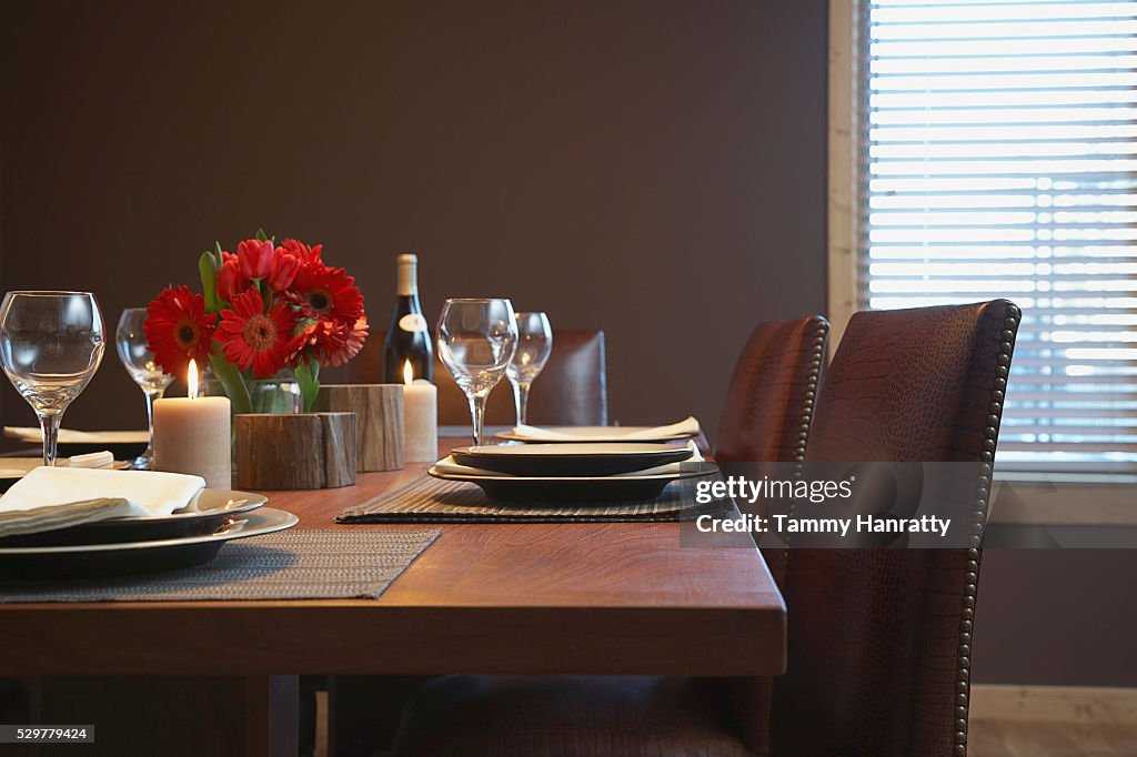 Dining table set for dinner