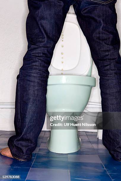 low section of man urinating - urine stock pictures, royalty-free photos & images