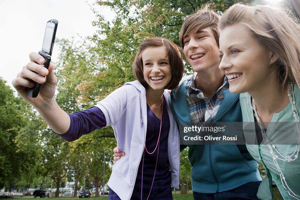 Students taking picture with camera phone