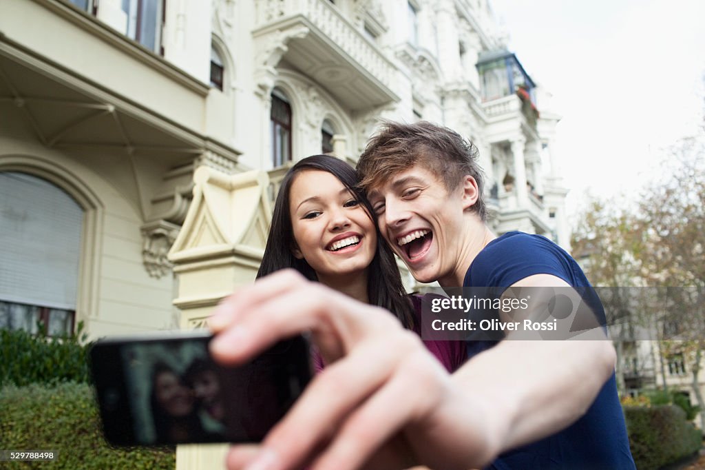 Young couple taking a self portrait