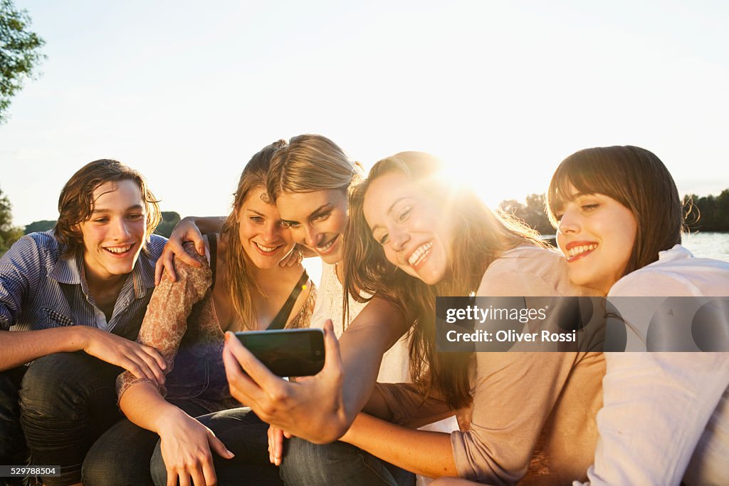 Young friends looking at a picture