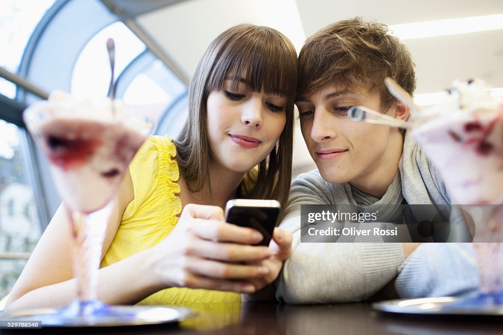 Young couple reading a text message