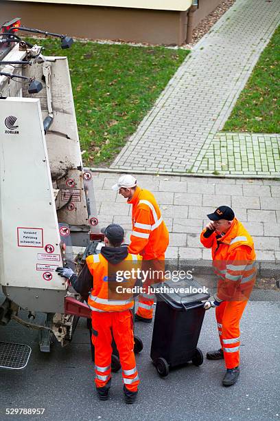 german trash collectors at work - sanitation worker stock pictures, royalty-free photos & images