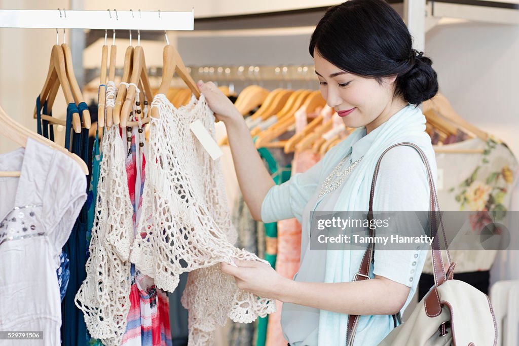 Young woman in clothing shop
