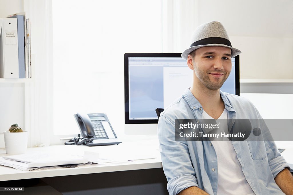 Portrait of young man in office