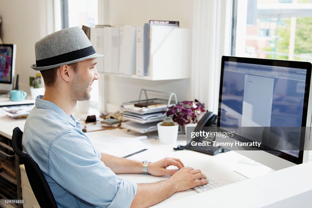Young man using computer at work