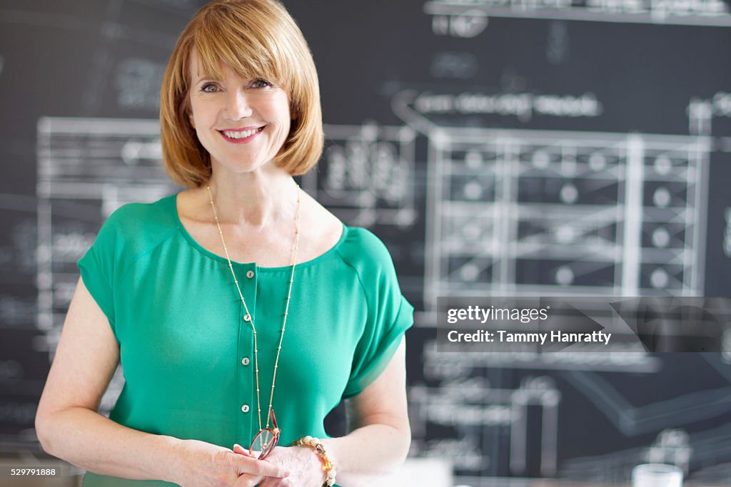 Portrait of woman with architectural design in background