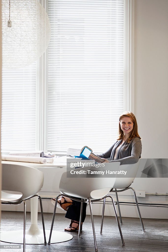 Portrait of woman sitting in office