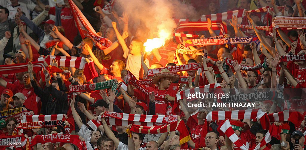 Liverpool supporters cheer prior to duri