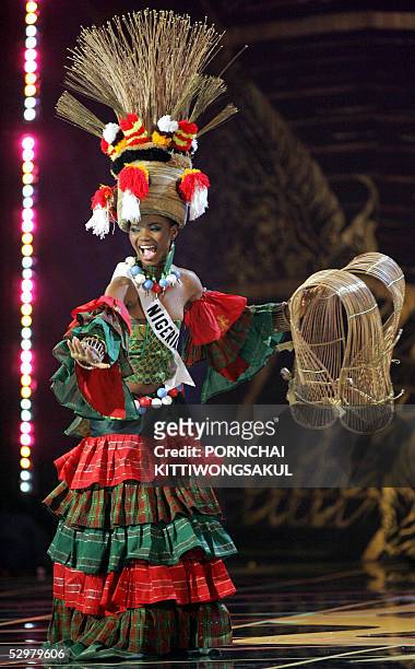 Miss Nigeria Universe 2005, Roseline Amusu performs during the National costume competition in Bangkok, 25 May 2005. The 54th annual Miss Universe...